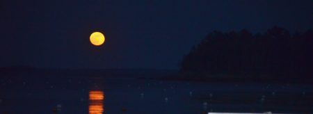 Bright full moon rising over Camden Harbor and Curtis Island