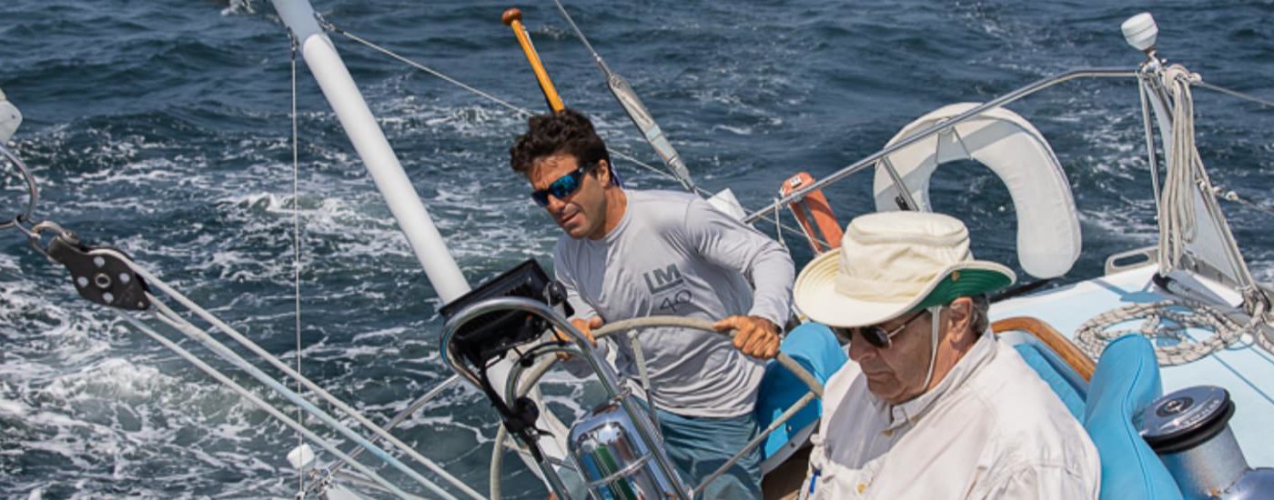 Close up view of a boat crew sailing on the ocean